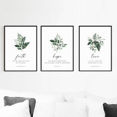 three framed art prints on the wall above a couch