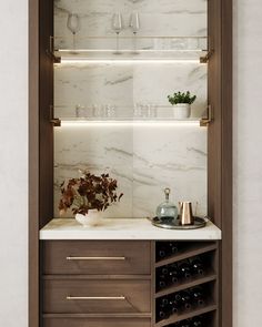 In-home dry bar design idea. Warm walnut cabinets and shelving with marble backsplash. Bar accessories such as wine and drinking glasses are in view. Bar has mini wine fridge beneath the counter. Dry Bar Ideas, Dining Room Built In, Coin Bar, Marble Bar