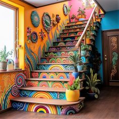 the stairs are painted with bright colors and designs on them, as well as potted plants