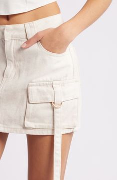 This casual-cool denim skirt features cargo pockets with drapey ring belts for a modern utilitarian vibe. Zip fly with button closure Five-pocket style Cargo flap-patch pockets 97% cotton, 30% lyocell Hand wash, line dry Imported Latest Skirts, Denim Cargo, Style Cargo, Denim Patches, Cargo Skirt, Gray Skirt, Fabric Gifts, Free Fabric, Wrap Skirt