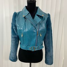 Nwt Kaylee Kollection Faux Leather Crop Moto Jacket Faux Fur Sleeves Zip Teal Blue Medium Crop Jacket Collar Long Sleeves Faux Fur Faux Leather Zipper Detail Zipper Closure 55% Pu 45% Cotton Hand Wash Cold Measurements (Flat): Bust 19” Length 17” Sleeve 23” Fitted Blue Outerwear With Faux Fur Lining, Blue Trendy Outerwear With Faux Fur Trim, Trendy Blue Outerwear With Faux Fur Trim, Trendy Blue Leather Jacket With Zipper Closure, Trendy Blue Leather Jacket With Zipper, Chic Blue Biker Jacket With Long Sleeves, Chic Blue Long Sleeve Biker Jacket, Chic Blue Leather Jacket, Chic Blue Long Sleeve Leather Jacket