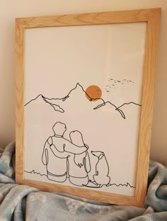 a drawing of two people hugging in front of a mountain and sun on the horizon