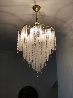 a chandelier hanging from the ceiling in a room