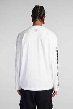 T-Shirt in white cotton, round neck, long sleeves, logo print on chest , long sleeves with print, straight hem, 100% cotton, Made in Albania, Model is 187 cm and wears size L Branded Long Sleeve Tops For Streetwear, White Long Sleeve Graphic T-shirt, Long Sleeve Branding T-shirt For Streetwear, Long Sleeve T-shirt For Streetwear, White Long Sleeve Tops With Graphic Print, White Long Sleeve Top With Graphic Print, Long Sleeve Cotton T-shirt With Logo Print, White Cotton Sweatshirt With Text Print, White Long Sleeve T-shirt With Branding