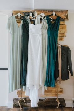 the bride's dresses are hanging up in her bridal suite