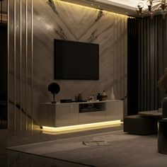 a modern living room with marble walls and flooring is lit up by recessed lighting