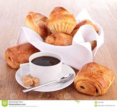 coffee and croissants on a wooden table