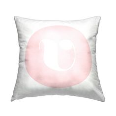 a white and pink pillow with the letter u in it's center on a white background