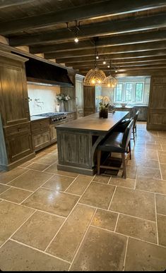 a large kitchen with an island in the middle