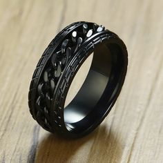 Elevate your style while finding a sense of calm with our captivating Cool Black Spinner Chain Ring for Men. This exceptional piece combines a sleek design with a unique feature that is perfect for anxiety relief. Crafted from high-quality stainless steel, this ring boasts a tire-textured surface with rotatable links, exuding an edgy punk vibe that effortlessly complements your individual style. Key Features: Unique Design: The tire texture and rotatable links create an eye-catching appeal, addi Ring Man, Meditation Ring, Fidget Rings, Black Ring, Stylish Rings, Ring Shapes, Spinner Ring, Ring For Men, Spinner Rings