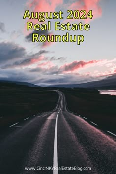 an empty road with the words august real estate roundup in green and pink clouds