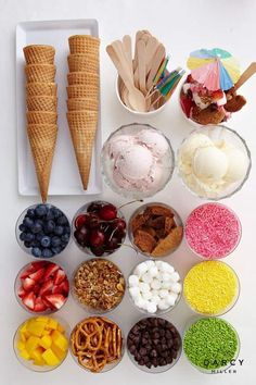 an assortment of ice creams, fruit and pretzels