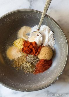 spices and seasonings in a bowl on a marble counter