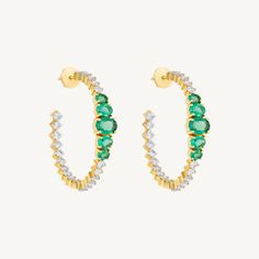 Major statement alert. These phenomenal hoops featuring substantial bright green emeralds and diamond hoop earrings are great for day or an evening out. Set in 14k yellow gold. Total emerald weight: 3.15ct Total diamond weight: 3.05ct Diamond color: G-H, Diamond clarity: VS Dimensions: 1 1/2" w x 1 1/2" l Fine Jewelry Emerald Hoop Earrings In Green, Green Emerald Hoop Earrings In Fine Jewelry Style, Emerald Green Hoop Earrings Fine Jewelry, Green Emerald Hoop Earrings Fine Jewelry, Green Diamond Hoop Earrings Fine Jewelry, Green Hoop Earrings With Prong Setting, Luxury Green Hoop Earrings, Luxury Green Hoop Jewelry, Green Emerald Hoop Earrings For Anniversary