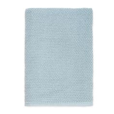 a light blue knitted blanket on a white background