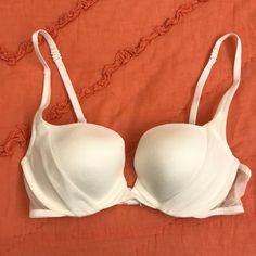 Victoria Secret’s White Push Up Bra, New Without Tags Classic White Bra With Removable Pads, Classic White Summer Bra, White Fitted Feminine Bra, White Padded Underwire Bra, Feminine White Underwire Bra, White Padded Push-up Bra, Classic Underwire Bra For Spring, White Seamless Push-up Bra, Feminine White Bra For Spring