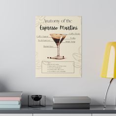 a poster on the wall above a desk with a lamp and some books in front of it