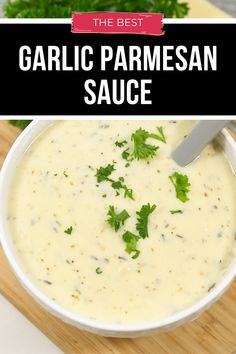 the best garlic parmesan sauce in a white bowl on a wooden cutting board