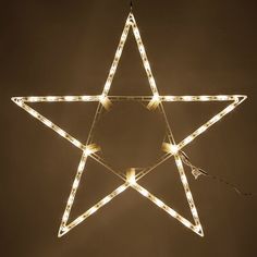 a lighted star hanging from the ceiling