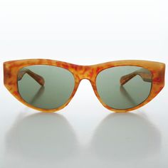 Gorgeous 1950s inspired cat-ish sunglass The shape is beautiful. Check out the amazing colors you can only get with acetate material. Optical quality frame with wire core temples. Made in the mid-80s and paying homage to the 40s and 50s.  New old stock. Never worn. Great condition. UV Protection. NOS deadstock Made in Korea FIT INFORMATION 55mm Eye Size 18mm Bridge 145mm Temple/Arm Width 5 1/2 Inches height 2 Inches Shop more Vintage Sunglasses @ https://www.etsy.com/shop/SunglassMuseum Shop mor Retro Brown Cat Eye Sunglasses With Mirrored Lenses, Vintage Brown Cat Eye Sunglasses With Gradient Lenses, Vintage Cat Eye Sunglasses With Gradient Lenses, Vintage Cat Eye Wayfarer Sunglasses With Gradient Lenses, Retro Wayfarer Sunglasses With Uv Protection, Retro Polarized Cat Eye Sunglasses, Retro Polarized Cat Eye Wayfarer Sunglasses, Vintage Cat Eye Sunglasses With Uva Protection, Retro Wayfarer Sunglasses For The Beach