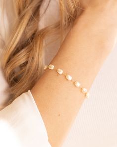 Elevate your outfit with the Lily Bracelet. This chunky pearl bracelet is a must-have addition to any fun and chic outfit. With an extender for easy wearing, it is one of our favorites. Stacked here with our Chloe Bracelet, Camilla Bracelet, and our Devon Bracelet. The sister to this is our Lily Necklace! Details: - Gold Filled - 2" extender Pearl Chain Bracelets, Chic Adjustable Pearl Bracelet With Pearl Charm, Chic Adjustable Pearl Bracelet With Charm, Chic Adjustable Pearl Bracelet, Party Pearl Drop Beaded Bracelets, Chic Adjustable Bracelet With Pearl Charm, Chic Adjustable Bracelets With Pearl Charm, Chic Pearl Bracelet As Gift, Pearl White Pearl Bracelet For Everyday Wear