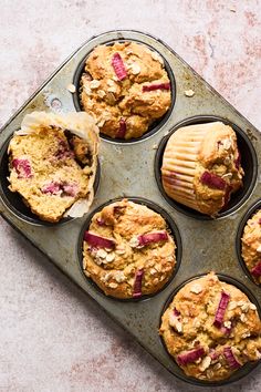 several muffins in a pan on a table