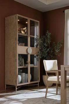 a living room filled with furniture and a potted plant