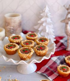 a white plate topped with mini christmas pies