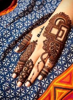 henna tattoo on the palm of someone's hand