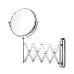 a round mirror is next to a metal rack with two hooks on it and a towel rail