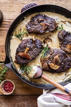 steak with mushroom sauce in a cast iron skillet