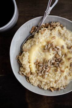 a bowl filled with oatmeal and topped with nuts