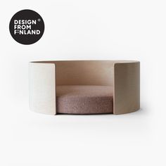 a chair made out of plywood with a black circle logo above it that says design finland