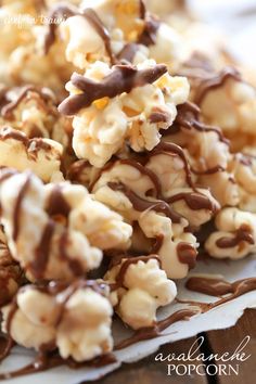 chocolate caramel popcorn clusters are piled on top of each other