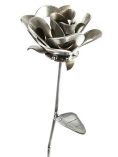 a metal flower is shown on a white background