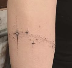 a woman's arm with stars on it