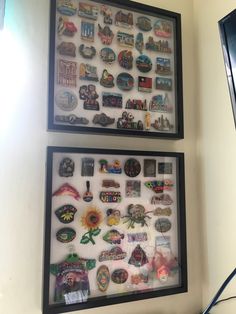 there are two framed pictures on the wall with magnets attached to each one's sides