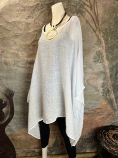 This 001IAV Oversized Gauze Tunic Top is perfect for the fashionista in search of a go-to favorite shirt.Constructed from linen gauze, it's lightweight and free flowing with an oversized silhouette. Don't wait, this stylish top is sure to sell out fast. Machine Washable on Gentle. Fluff to dry. Vina By Verandah's oversized gauze top. 100% of the finest gauze. Bust measurements 51.5 X 2 103 length 34 arm hole is 10 Designed in Miami Manufactured in Europe with the best quality linen and gauze tha Summer Lagenlook Blouse For Daywear, Lagenlook Blouse For Summer Daywear, Flowy White Top For Beach Cover-up, Summer Lagenlook Blouse, Summer Beach Blouse Lagenlook Style, White Oversized Lagenlook Blouse, Summer Lagenlook Blouse For The Beach, Oversized White Lagenlook Blouse, Lagenlook Summer Blouse For The Beach