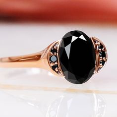 Waxing Gibbous – an enchanting engagement ring inspired by the moon’s waxing gibbous phase. Crafted in rose gold, it features a 2.72-carat oval-shaped natural black diamond as its centerpiece. Accented by 0.14 carats of round black and white diamonds, the Waxing Gibbous ring, with a total carat weight of 2.86, captures the moon's ethereal beauty and timeless allure. Ideal for those who appreciate the extraordinary elegance of natural black diamonds. Waxing Gibbous Phase, Diamond Oval Engagement Ring, Black Diamond Necklace, Black Diamond Studs, White Diamond Earrings, Black Diamond Earrings, Oval Engagement Ring, Oval Diamond Engagement Ring, Engagement Rings Marquise