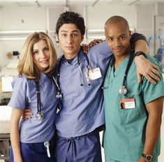 the cast of grey's anatomy poses for a photo in scrubs and scrubs