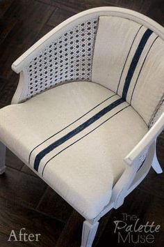 a white chair sitting on top of a wooden floor