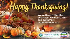 a thanksgiving card with pumpkins and gourds in a basket on a wooden table