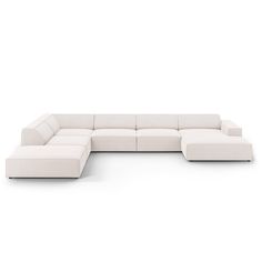 a white sectional couch sitting on top of a white floor