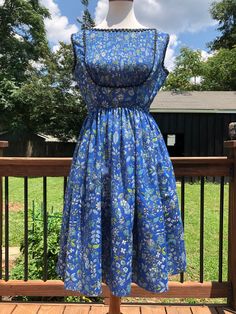 "Such a pretty blue floral dress! I love the accordion bib outlined in black rickrack trim. This dress can be transitioned from spring-autumn in my opinion. Just add a cropped cardigan for a more vintage look or a fitted denim jacket for something more hipster! You will most likely need a slip as she is fairly sheer. For the future owner: Please send picture, because I LOVE this one! Excellent vintage condition! Measurements taken flat, please double: Bust 19\" Waist 13\" Length 38\" All sales a 1950’s Fashion, Jeanne D'arc, Dresses 1950s, Fitted Denim Jacket, Blue Floral Dress, Fashion 1950s, Jeanne D Arc, Taffeta Dress, Vintage Wardrobe