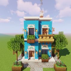 a blue house with lots of windows and balconies on the second floor is shown in minecraft