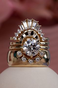 a close up view of a ring with diamonds on it