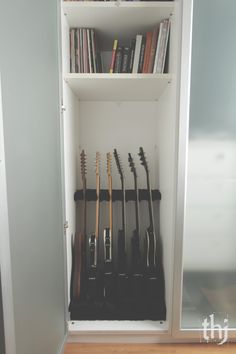 an open book case with guitars in it