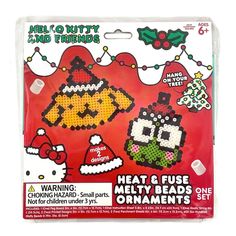 a package of cross stitch kits with christmas decorations on the front and back of it