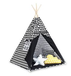 a black and white teepee with yellow pillows