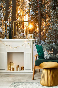 a living room filled with furniture and a fire place in the middle of a forest